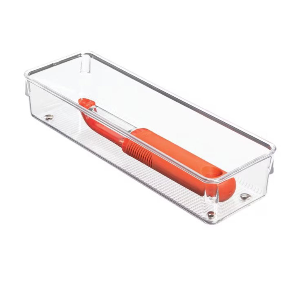 A clear rectangular Organizer (9.8 x 3.2 x 2) serves as a travel organizer, holding an orange-handled brush, and is shown at an angle against a white background.