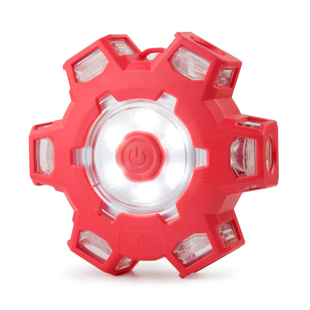The FRED (Flashing Roadside Emergency Disk) Light Pro is a red, hexagonal LED emergency flare, featuring a central power button, clear panels on every side, and a convenient hook at the top for hanging. Battery powered and shown illuminated in the image, this versatile safety disk is ideal for flashing roadside emergencies.