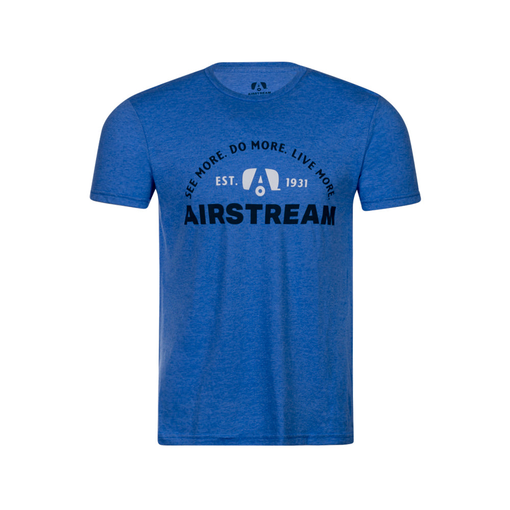 The Airstream See More. Do More. Live More. Tonal T-Shirt is a blue short-sleeve shirt featuring “AIRSTREAM” in bold black letters, with the inspiring words “SEE MORE. DO MORE. LIVE MORE. EST. 1931” arched above a trailer graphic—a perfect choice for adventurers who love to See More, Do More, and Live More on the open road.