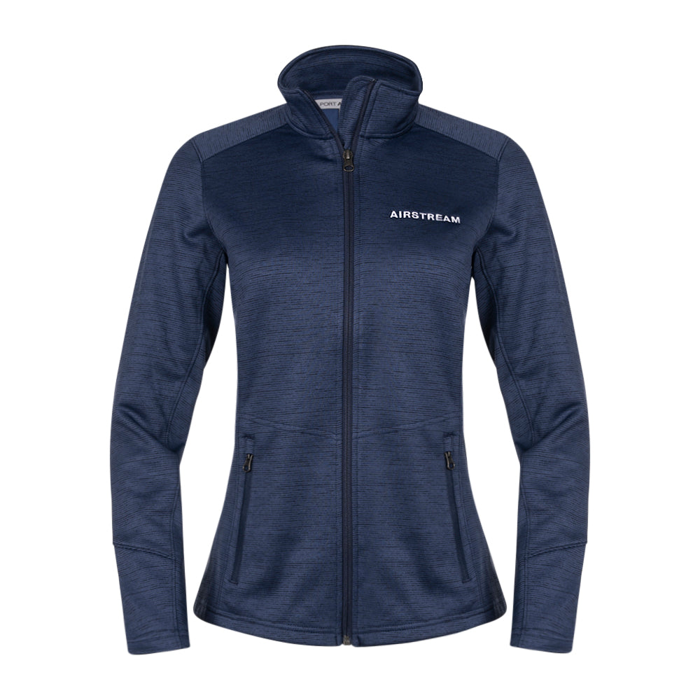 Introducing the Airstream Performance Fleece Women’s Zip Up Jacket—a navy blue, long sleeve polyester fleece jacket featuring two side pockets and “AIRSTREAM” embroidered in white on the left chest. This low-pill jacket is shown against a plain white background.
