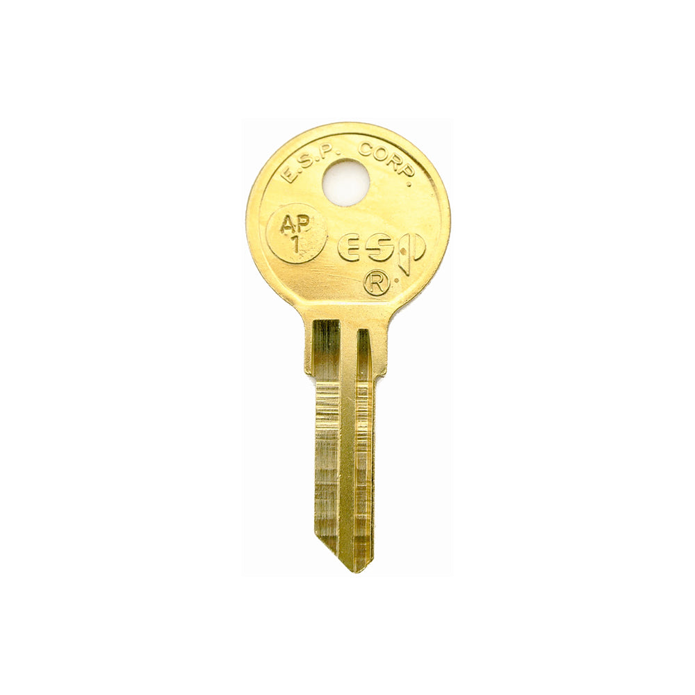 A gold-colored metal key with a round head, notched blade, and engraved markings is featured vertically on a white background—perfect as the Airstream Telescoping Compartment Door Pre-Cut Key (Part # 001101). Ideal for anyone seeking dependable Airstream replacement parts.